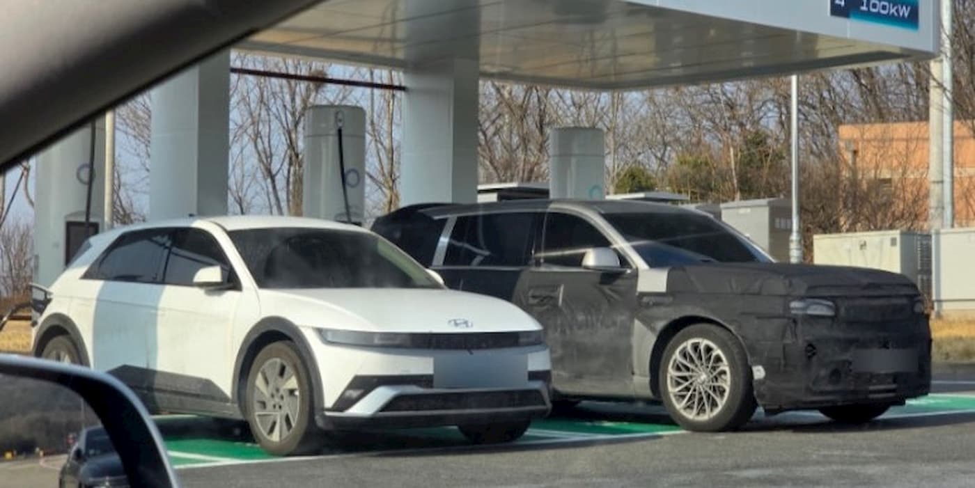 The Genesis GV90 looks massive charging next to the Hyundai IONIQ 5